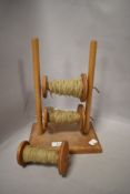 A vintage wooden wool winder.