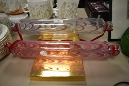 Two late Victorian glass confectionary rolling pins having coloured glass designs