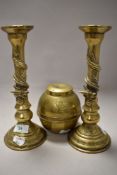 A 1924 dated brass Lipton souvenir tea caddy and a pair of brass candlesticks having dragon or