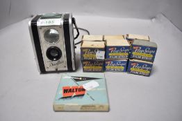 A vintage Kodak Duaflex camera and selection of film, mainly being Kay Peep scope