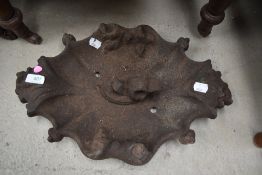 A cast iron bird bath top
