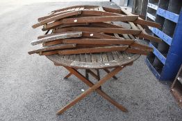 A 20th century teak garden table and chair set