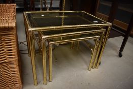A Mid century brass framed Italian style nest of three coffee tables