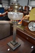 A Corinthian column oil lamp