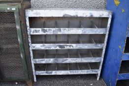 A 20th century metal cased industrial or garage shelf set