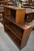 A mid 20th century mahogany three part book shelf