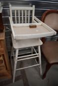 A vintage child's high/low chair, painted