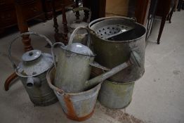 A collection of vintage metal ware to include watering cans, mop bucket, bucket and similar.