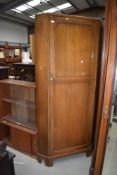 An early 20th Century oak corner hall robe