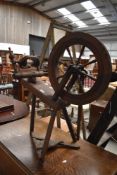 A Late Victorian oak framed spinning wheel having turned frame