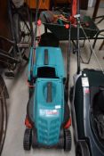A Bosch Rotak 32R electric lawn mower.