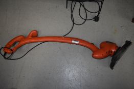 An Flymo electric garden strimmer