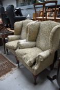 A pair of modern wing back armchairs in the Queen Anne Style , nice quality