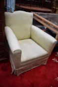 An early 20th century armchair of small proportions, later re upholstered.