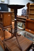 A 19th Century mahogany candlestand having circular top, turned column and triple splay legs