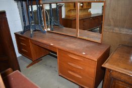 A vintage teak dressing table