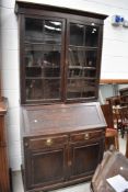 An early 20th Century oak bureau bookcase