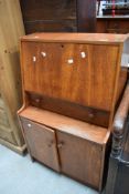 A vintage teak bureau of small proportions