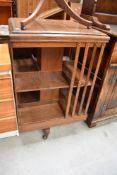 An Edwardian oak revolving bookcase