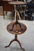 Two Victorian tea or wine tables with tripod bases on turned frames, larger one having leather top