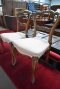 A set of six Victorian mahogany salon or dining chairs having shaped frame with later upholstery