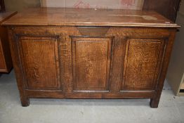An antique bedding box Kist having oak frame on square legs