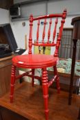 A Victorian spindle back kitchen dining chair , having turned frame, later painted in red
