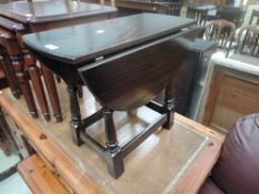 A stained oak drop leaf table of small proportions, Jaycee furniture Brighton LTD.