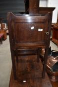 A 19th Century mahogany pot cupboard/night stand on square legs