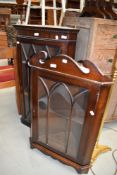 Two reproduction corner wall display cabinets
