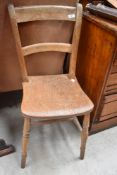 A 19th Century solid seat kitchen chair