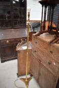 A vintage brass standard lamp