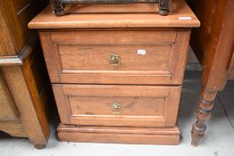 A modern two drawer bed side cabinet.