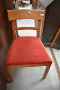 A Gordon Russell Ltd oak single chair with upholstered drop in seat, bearing manufacturers label.