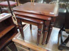 A nest of stained pine Ducal tables.