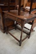 A 19th Century oak side table having frieze drawer and turned frame