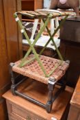 One vintage woven topped stool and a metal framed folding stool.