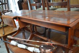 Two reproduction yew wood coffee/occasional tables both having drop flaps, Regency style frames
