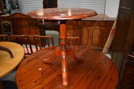 A modern pine pedestal side table