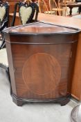 A Regency style reproduction mahogany corner unit.