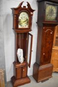 A modern long case clock in mahogany case