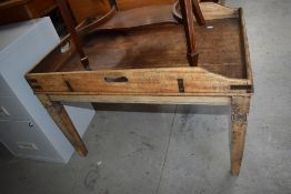 A rustic part stripped butlers tray table