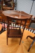 A Victorian mahogany occasional table having galleried undertier