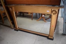 A Victorian over mantel mirror having shell decoration and gilt frame