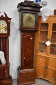 A period oak longcase clock having later electric movement, with square hood and brass face, shelved