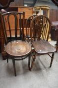 A vintage wheelback chair and a bentwood chair