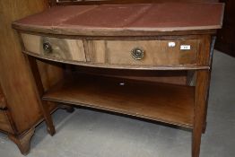 A Victorian Regency design sideboard or console table having curved frontage with tapered legs and