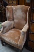 A Howard style wing back armchair