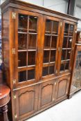 A nice quality reproduction bookcase, believed to be Titchmarsh and Goodwin