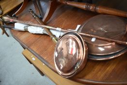 A selection of antique hard ware including two copper bed pans and post or carriage horn